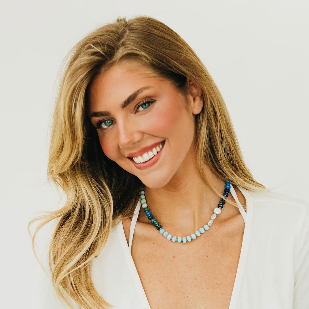 Waterproof ombre beaded necklace with light blue beads and darker blue accents