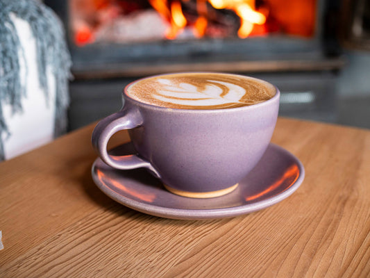 Purple stoneware latte cup with handle and matching saucer, cream rim, 10–12 oz