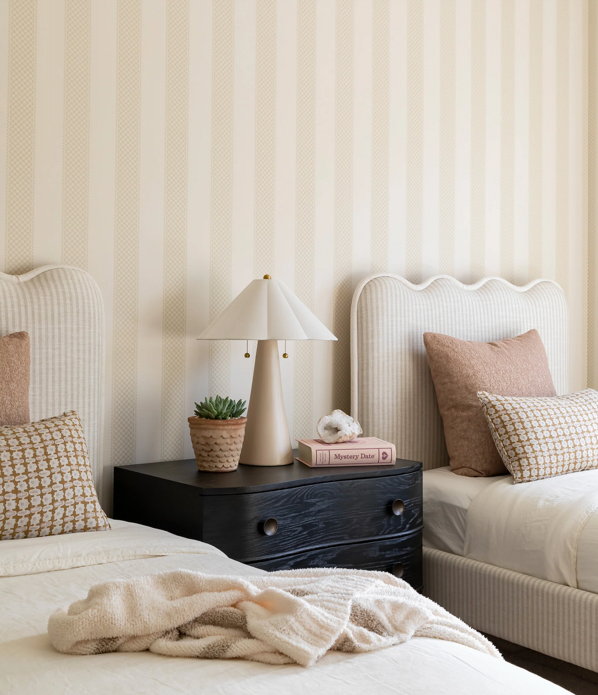 Saffron geometric pillow cover styled on a bed