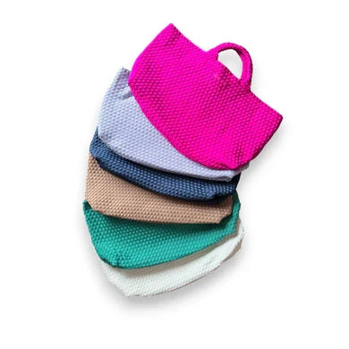 Stacked woven tile pouches with loop handle, shown with a matching woven tote