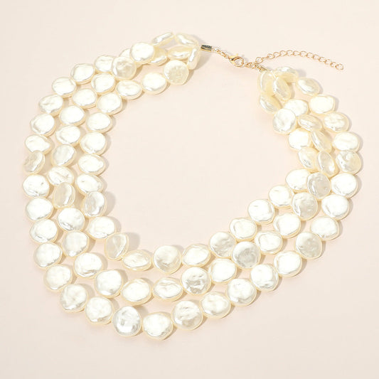 Triple-layer disc pearl beaded statement necklace with gold-tone chain and oval pearl discs