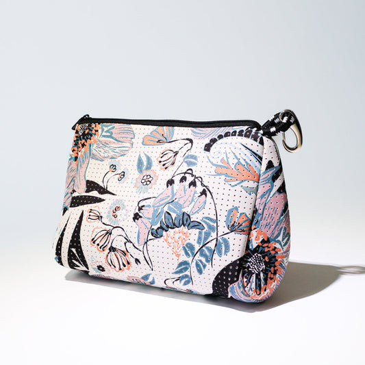 Zip-top canvas pouch with pastel blossom print and black trim, wrist keyring