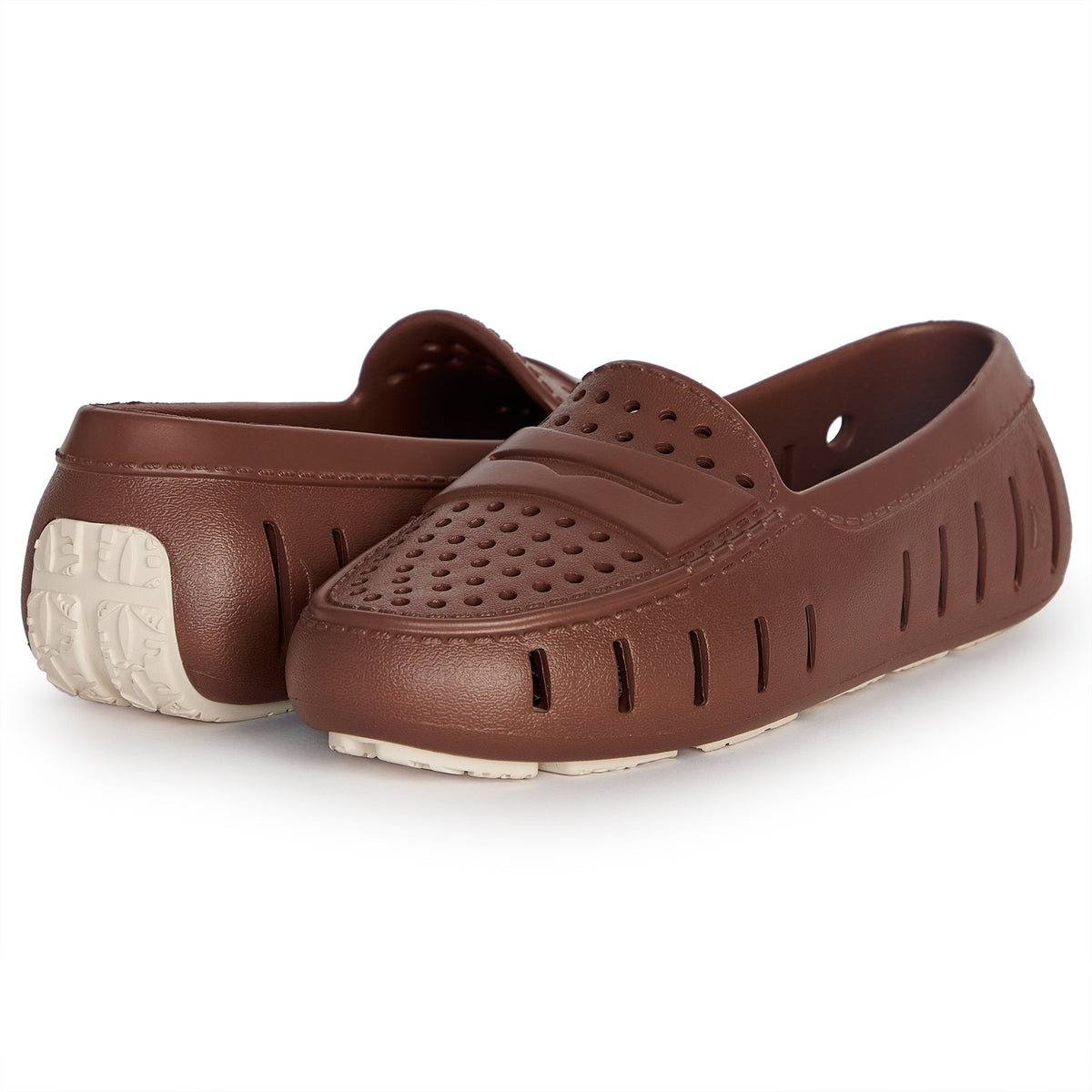 Pair of brown slip-on clogs with foam midsole and perforated forefoot