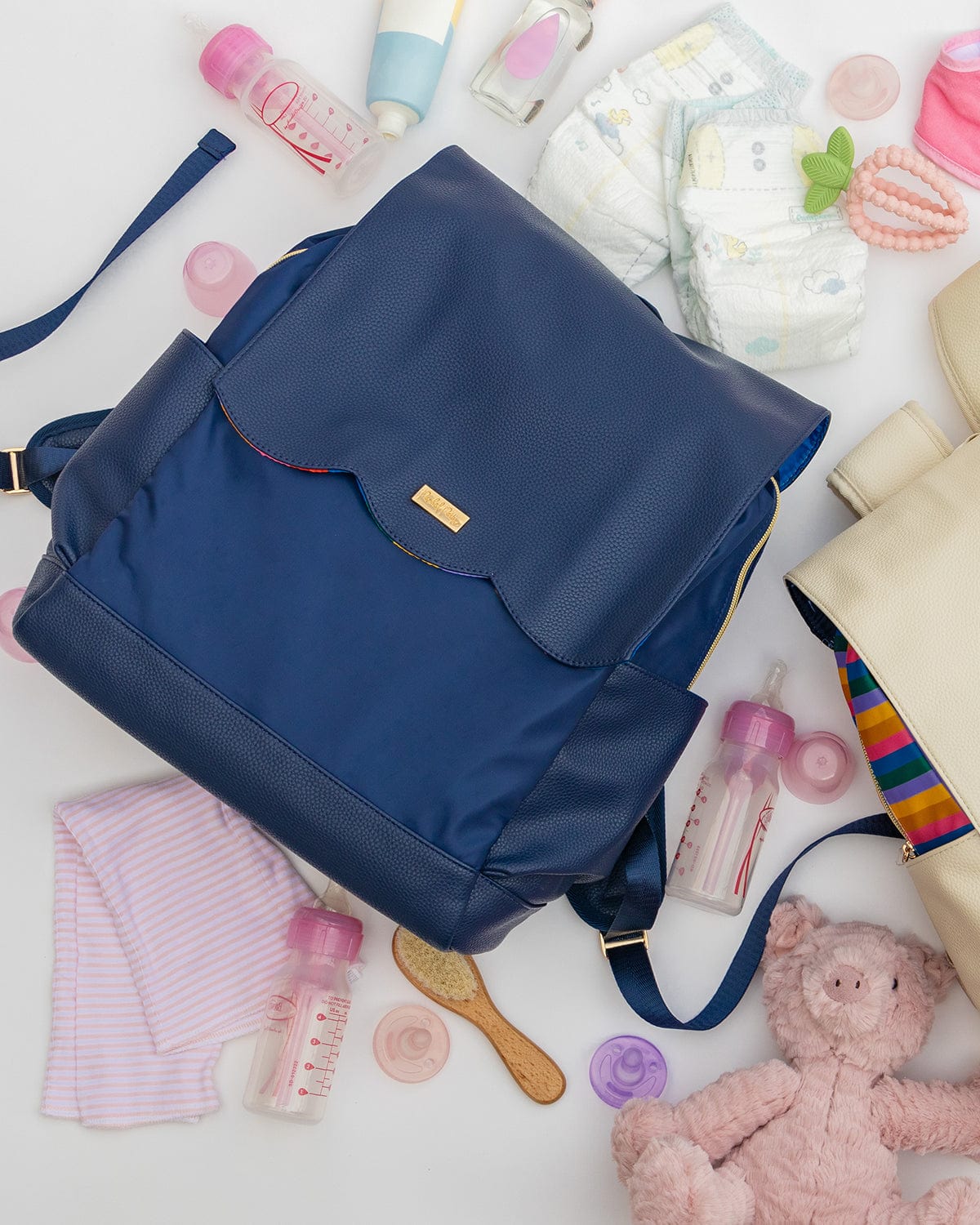 Navy diaper bag backpack with front flap pocket and shoulder straps