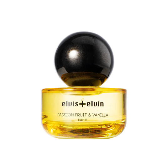 Passion fruit & vanilla parfum bottle with black spherical cap and amber glass