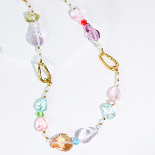 Pastel beaded necklace with gold chain and pink, blue, clear glass pebbles.