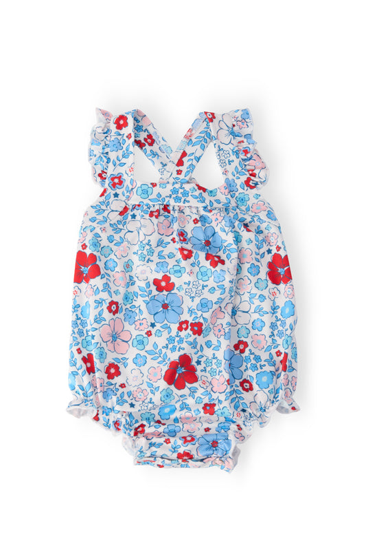 Blue floral ruffle cross-back romper with red accents and gathered legs