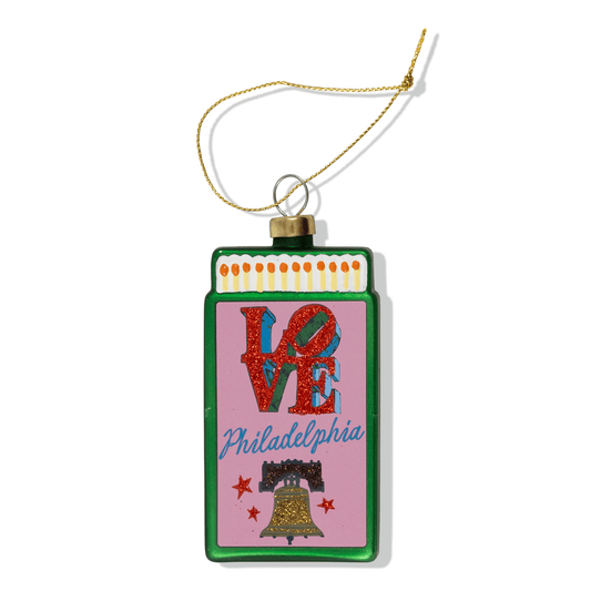 Matchbook-style holiday ornament with green border and 'VE' Philadelphia artwork