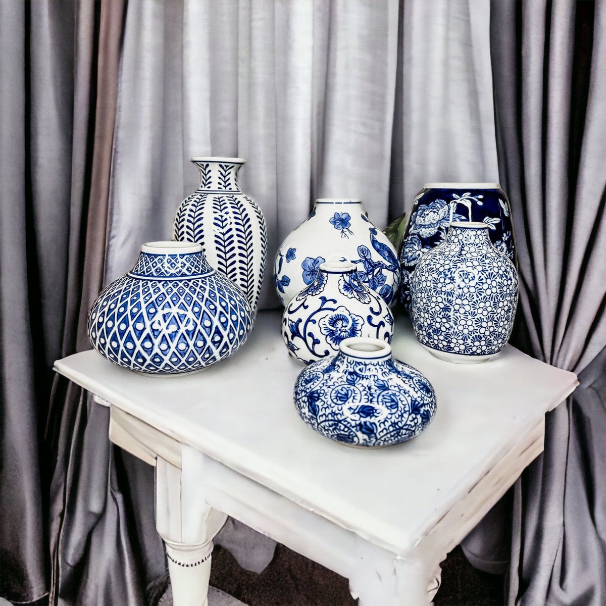 Blue-and-white ceramic vases in assorted shapes, bulb and tall-neck styles
