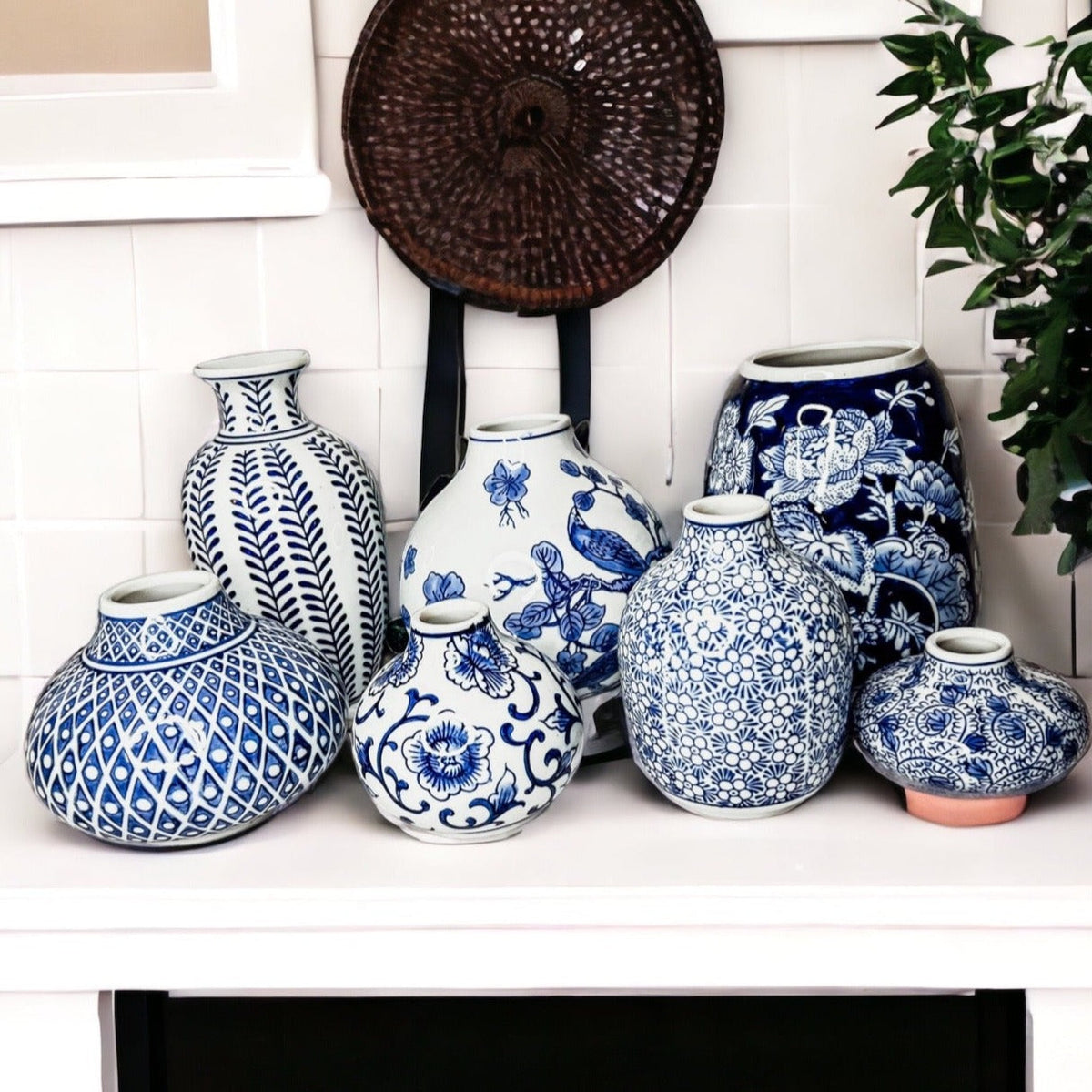 Assorted blue-and-white ceramic vases with different decorative motifs
