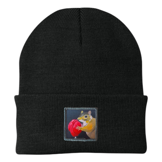 Black knit beanie with stitched front patch featuring a chipmunk and a red ball.