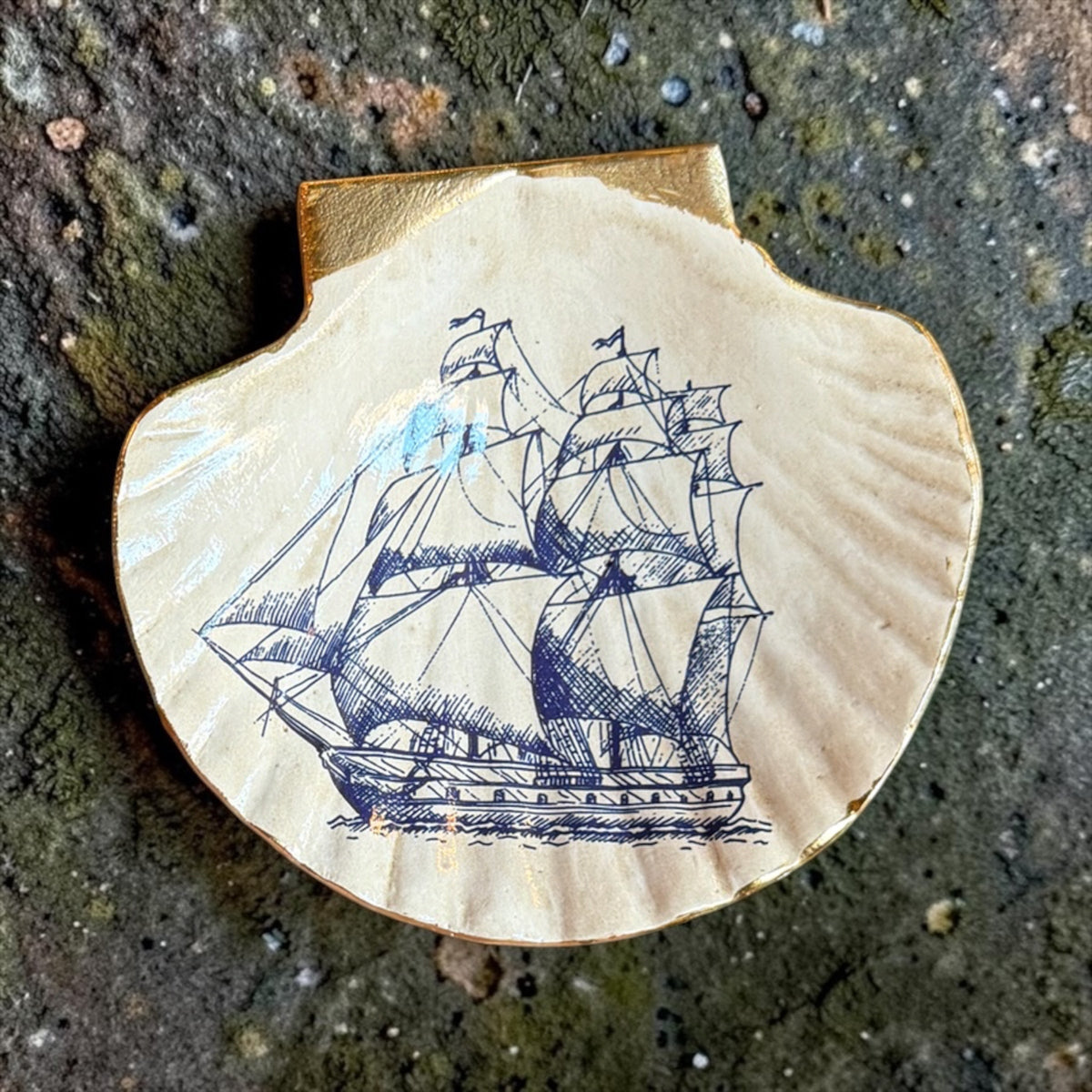 Blue ship-themed shell trinket dish with gold rim, scalloped seashell shape