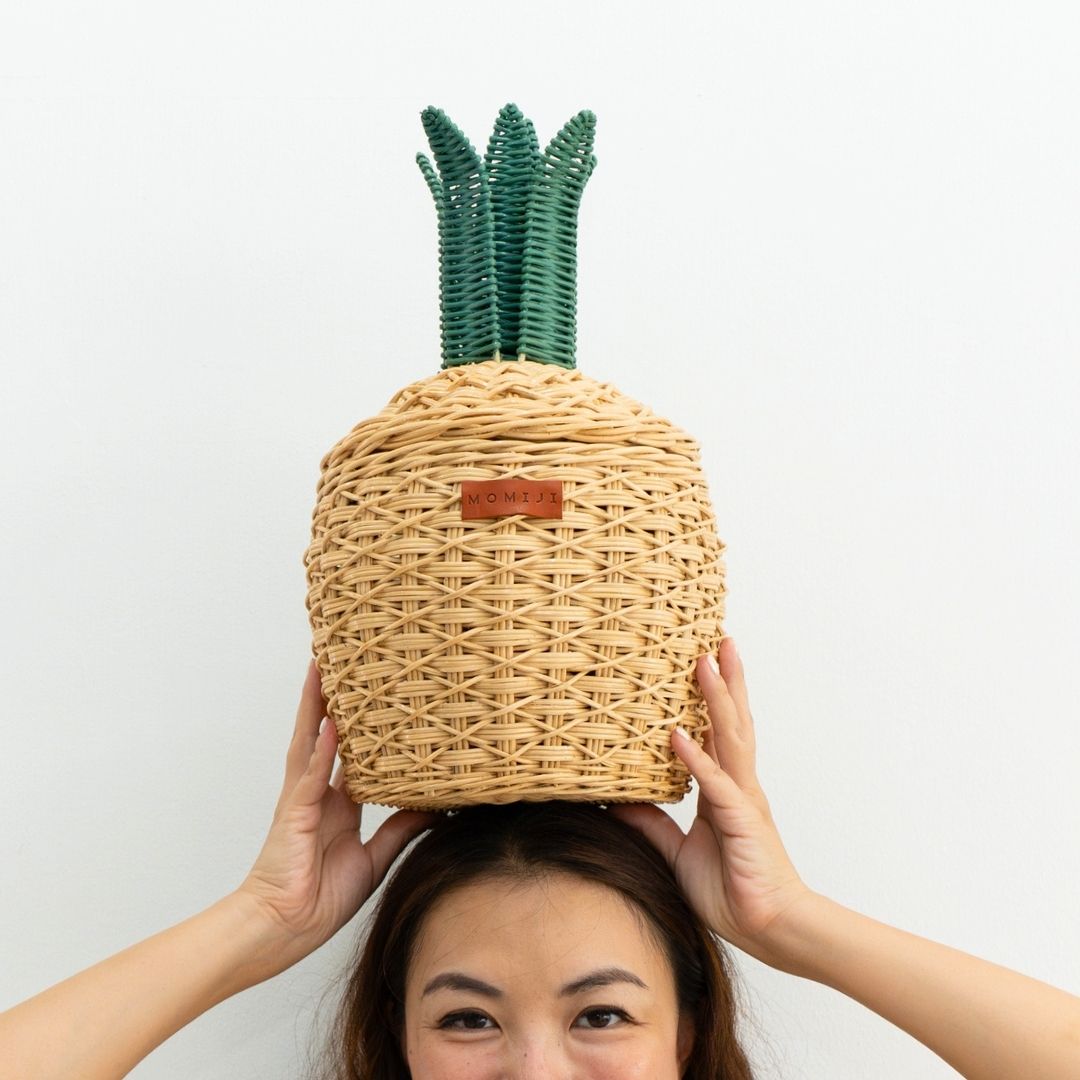 Natural rattan pineapple basket with woven green leafy top