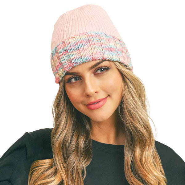 Pink knit fleece beanie with multicolor band and folded cuff