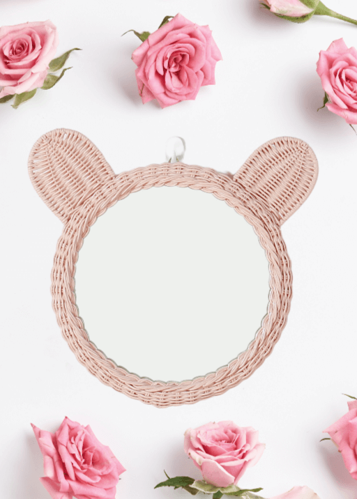 Pink woven rattan teddy bear mirror with round glass and hanging loop