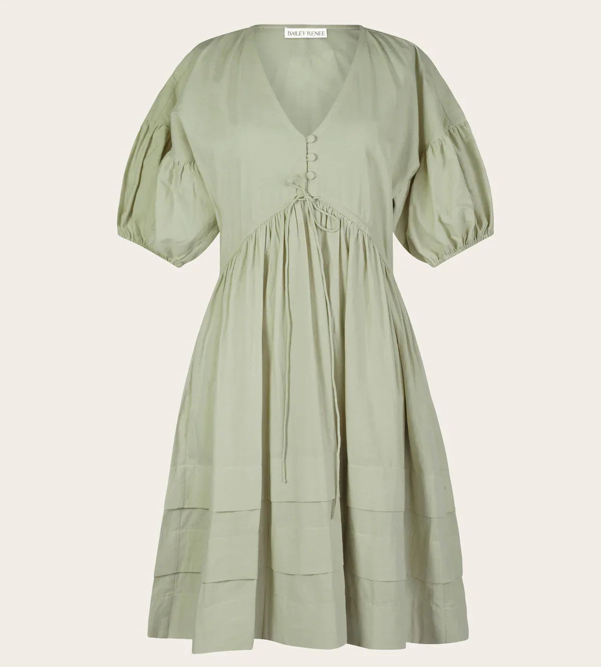 Pale sage Poet Dress with buttoned V-neck, puff sleeves, drawstring waist, and tiered skirt
