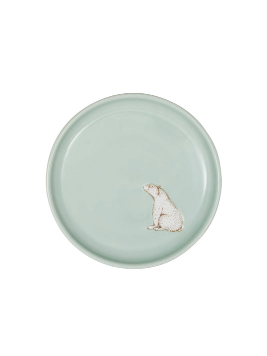 Round mint ceramic plate with small polar bear illustration at center