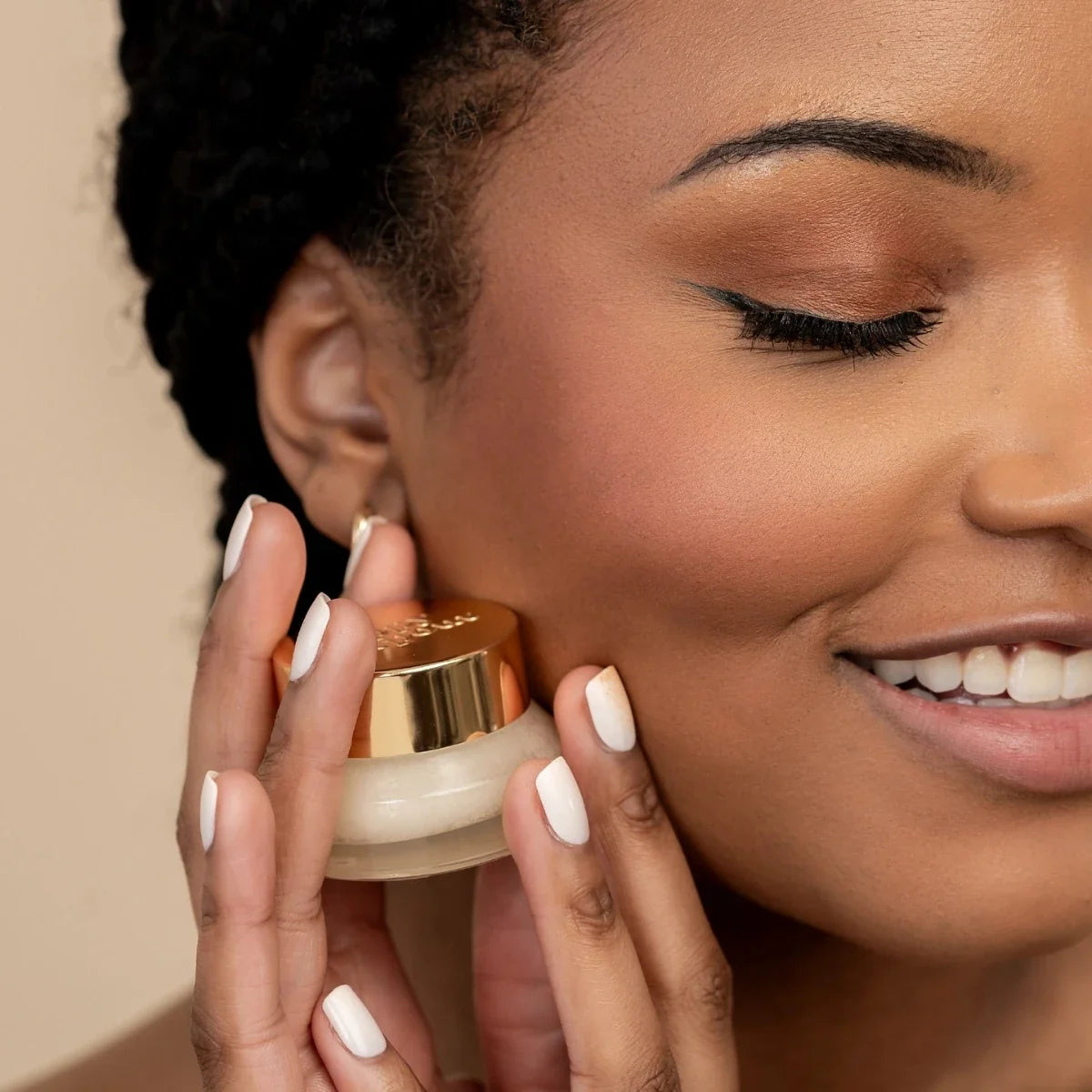 Woman using Island coconut lip scrub from a small jar