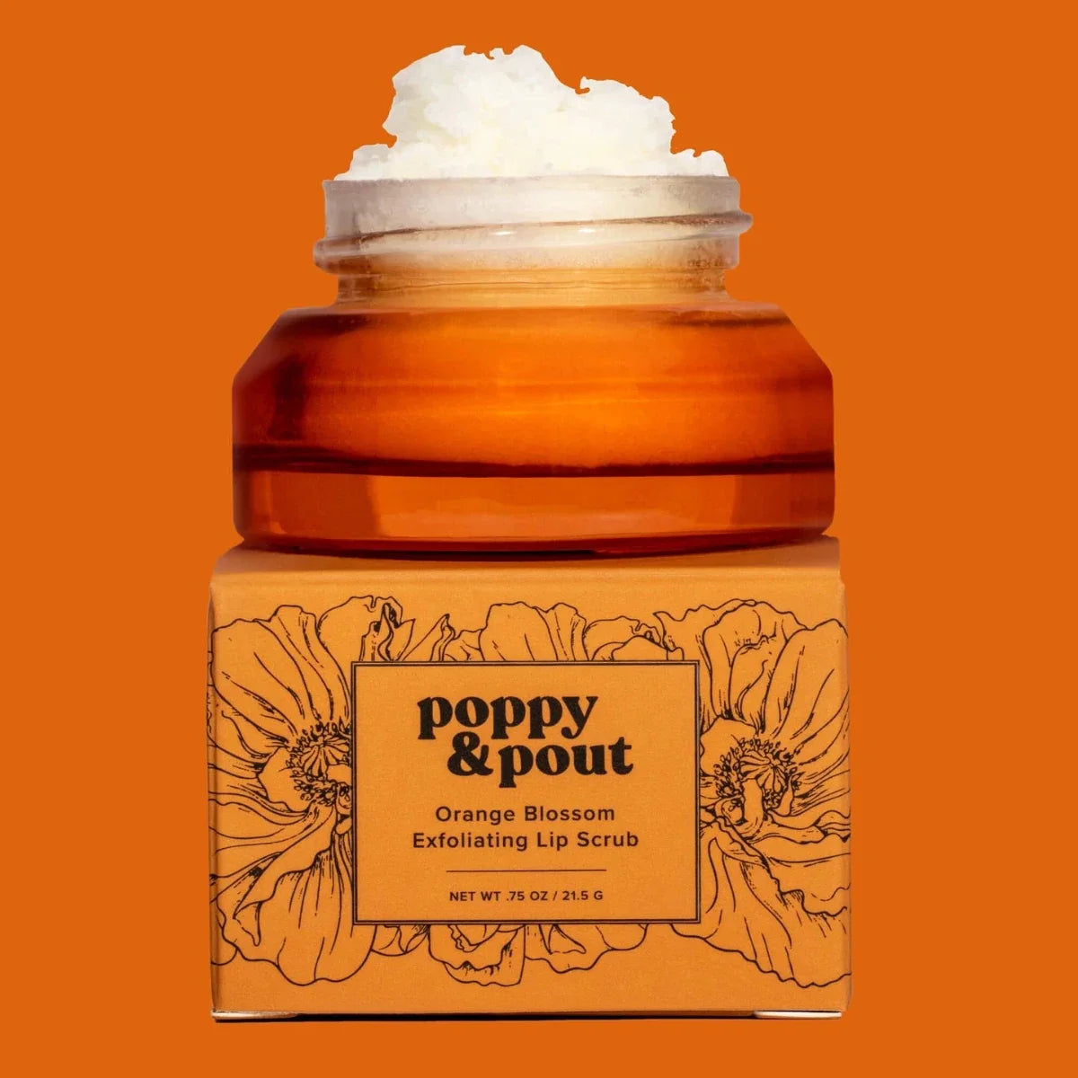 Orange blossom lip scrub in amber jar with white exfoliating scrub on top