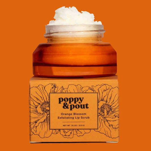 Orange blossom lip scrub in amber jar with white exfoliating scrub on top