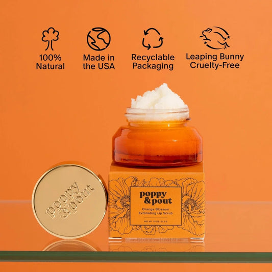 Orange blossom lip scrub jar with matching round lid, amber base, white scrub