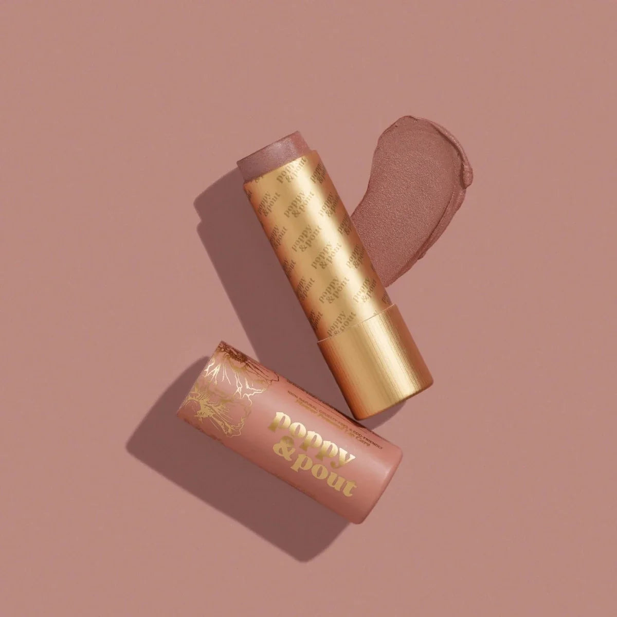 Lip tint in a gold tube with pink applicator cap, plus matching lip product