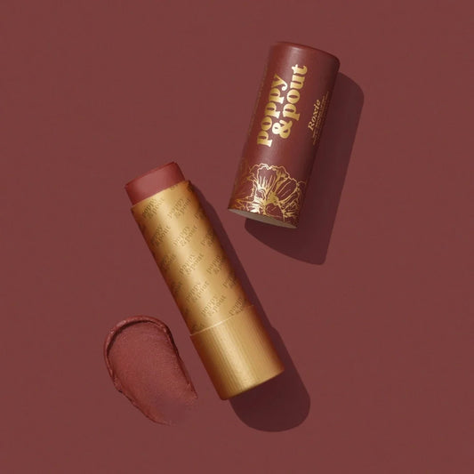 Lip tint tube in gold with brown cap; open lip swatch in mauve-rose