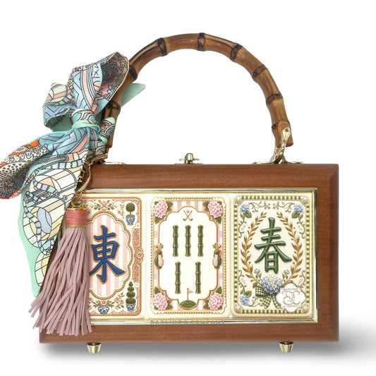 Wooden brown box bag with bamboo handle, decorative mahjong panels, and tassel scarf