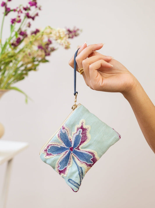 Light mint mini pouch with gold zipper, blue/purple embroidered flower, wrist strap