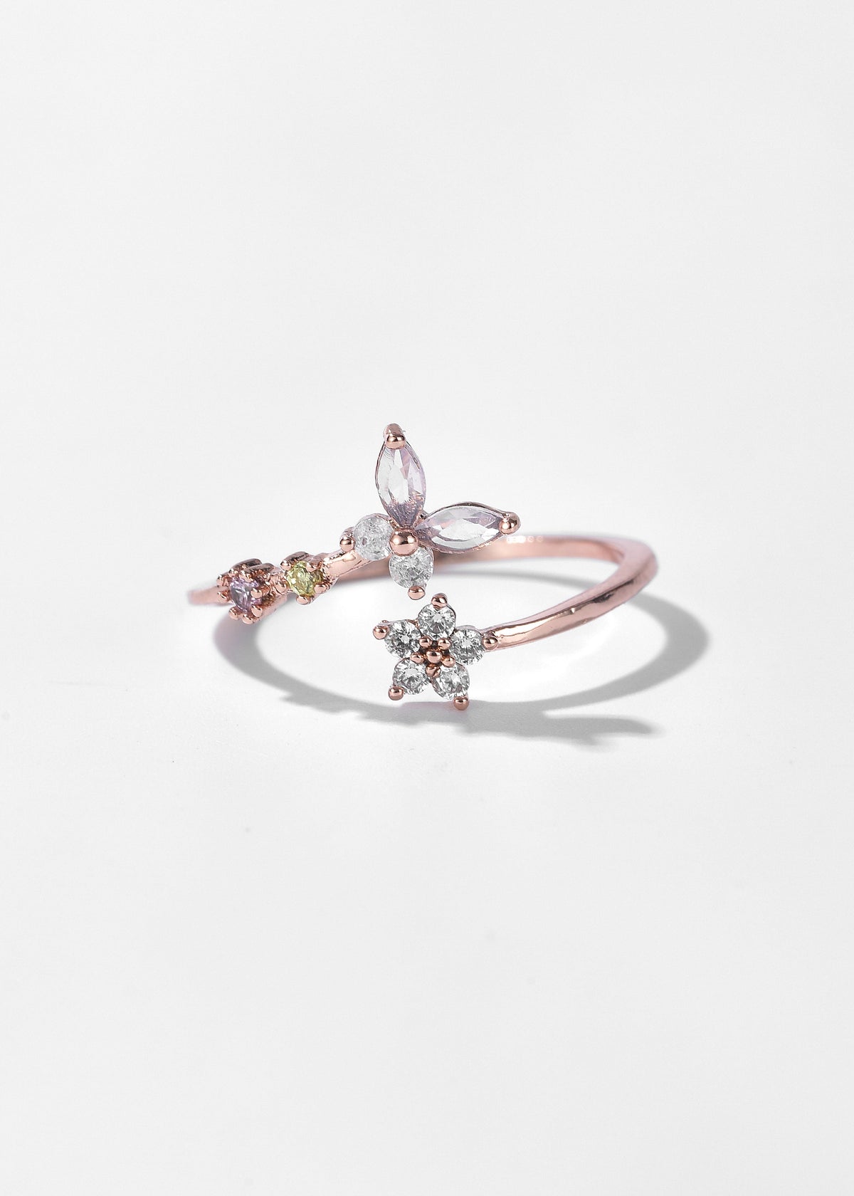Vintage Heart Ring in rose gold with marquise stones, floral charms, and colorful accents
