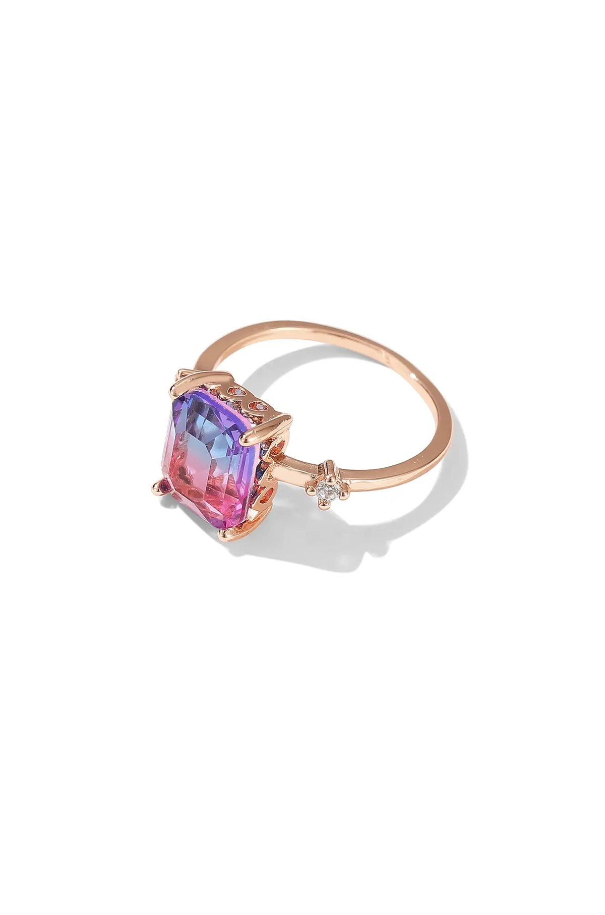 Gradient pink sapphire ring in rose gold with an emerald-cut pink and violet stone and side accents