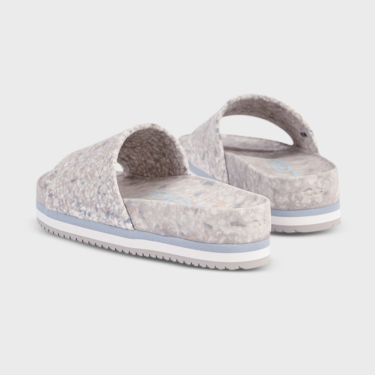 Back view of faded denim slide sandals with padded footbed and blue-edged sole