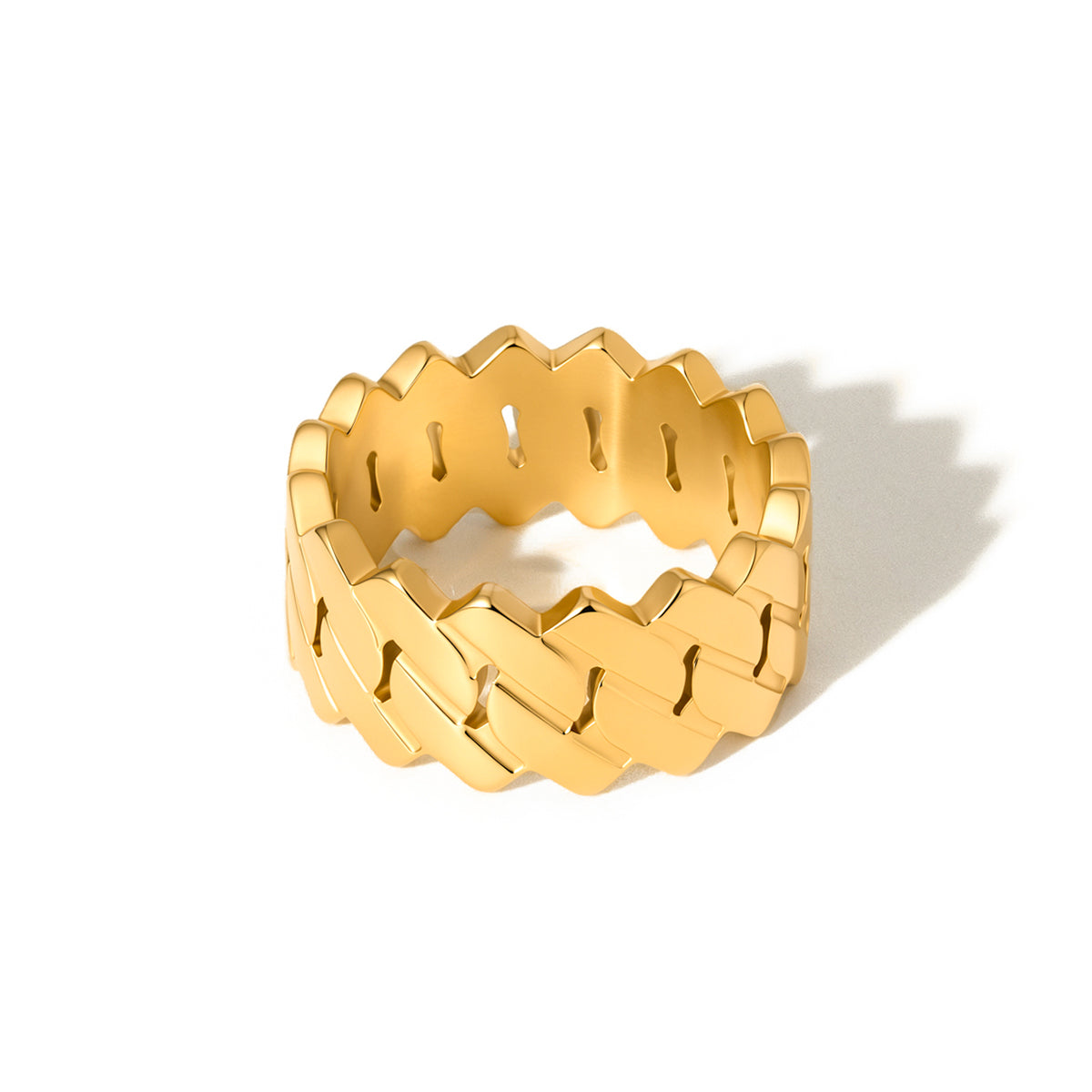 Gold-tone metal statement ring with zigzag cutout pattern on wide band