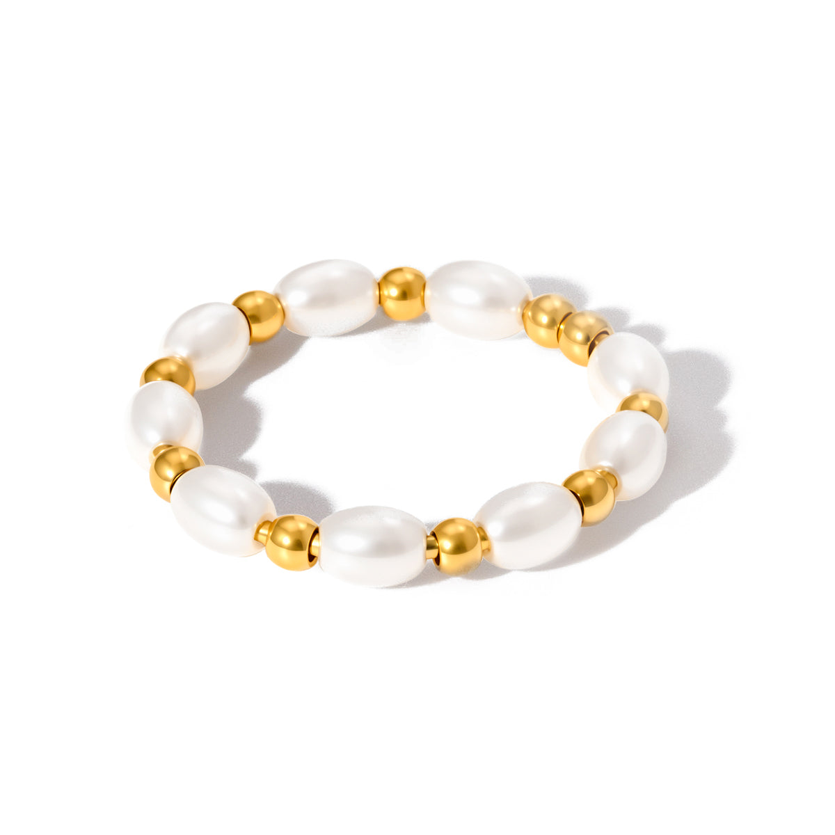 White pearl beaded bracelet with gold spacer beads, close-up