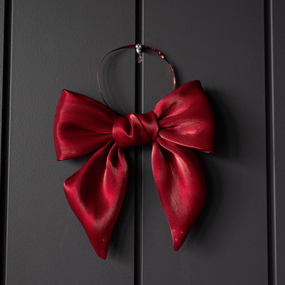 Red satin gauze bow ornament with looped hanger, wide ribbon loops and center knot