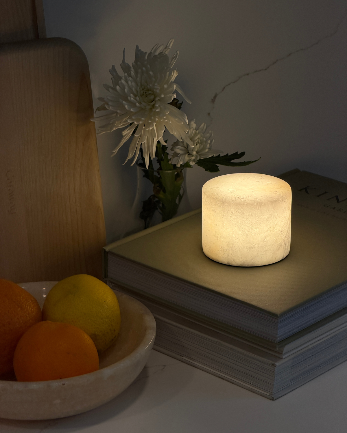Portable lamp with warm white cylindrical light diffuser, glow on