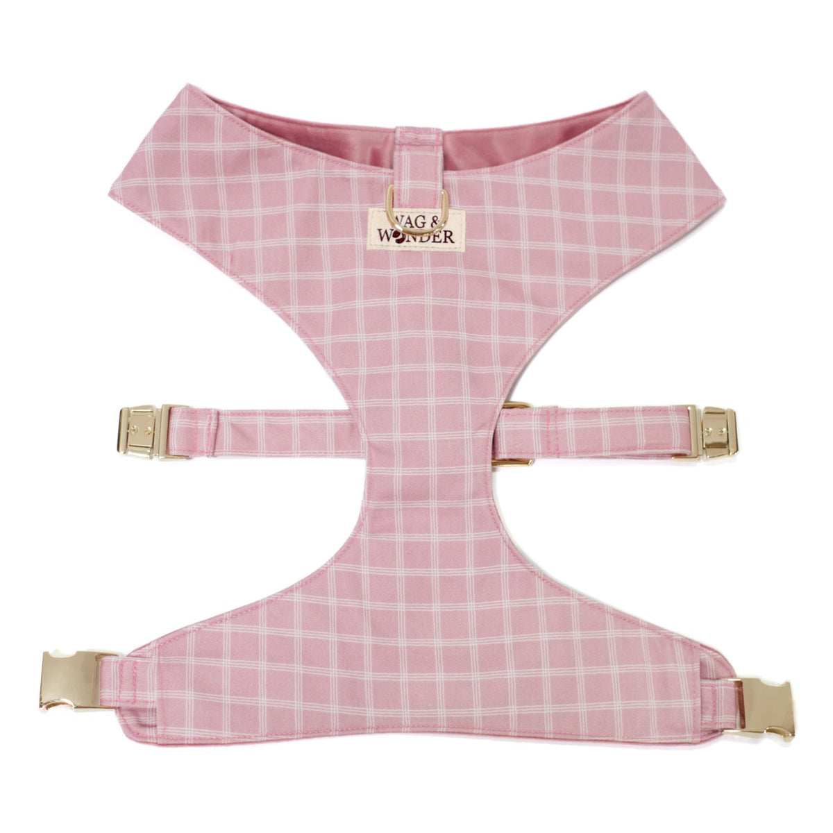 Pink plaid reversible dog harness with front buckle straps and central logo patch