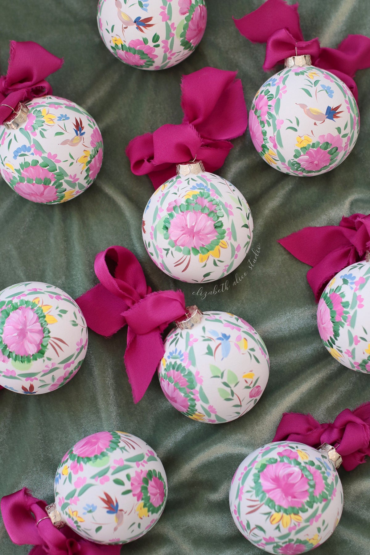 Hand-painted floral ornaments with rose medallions, bird motifs and magenta bows