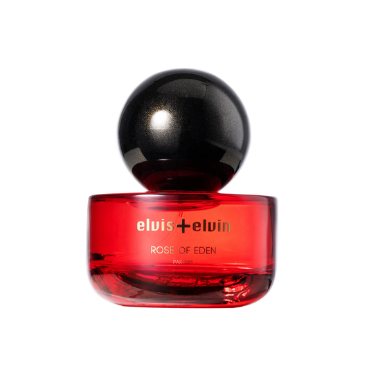 Rose of Eden perfume bottle, red glass with black spherical cap