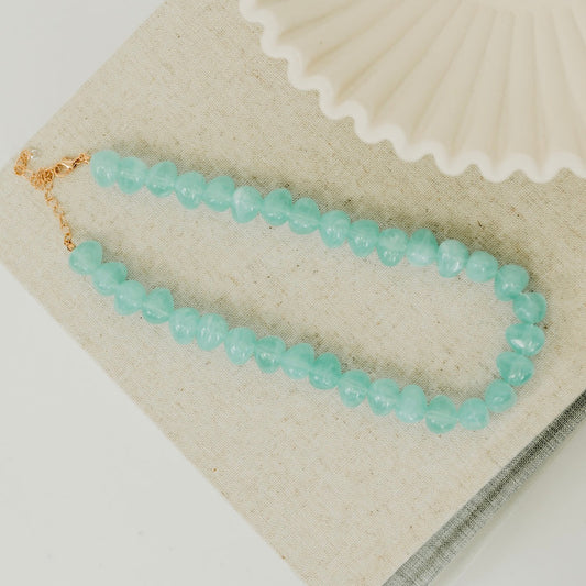 Turquoise beaded necklace with gold clasp, faceted round beads