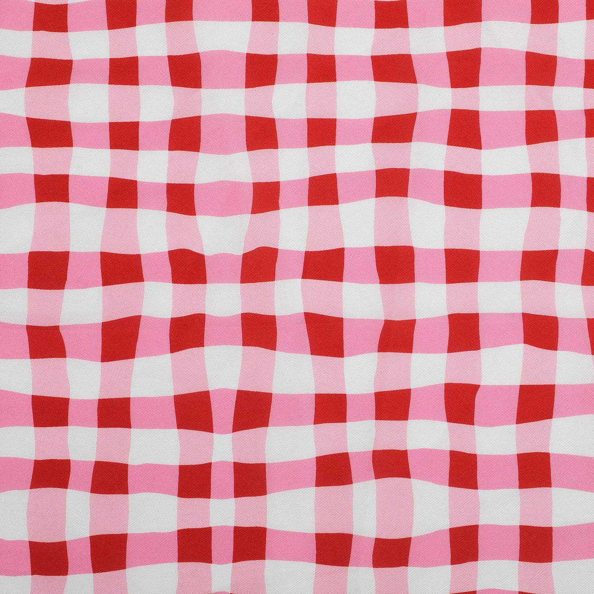 Red and white gingham check fabric close-up