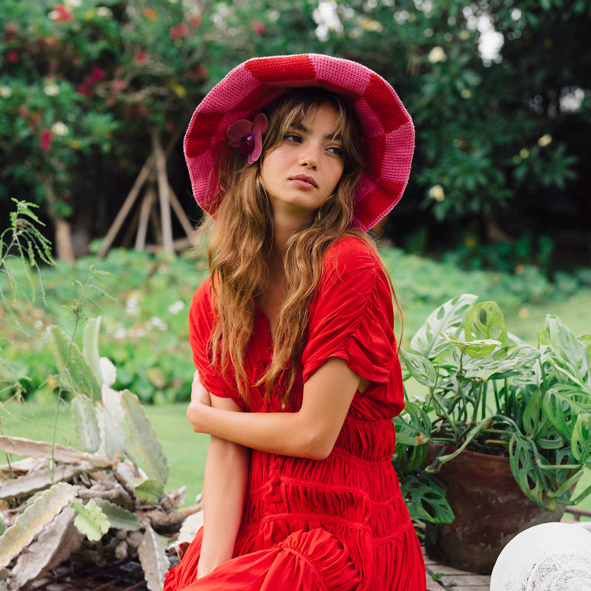Red and pink checkered crochet bucket hat, wide brim, side flower detail