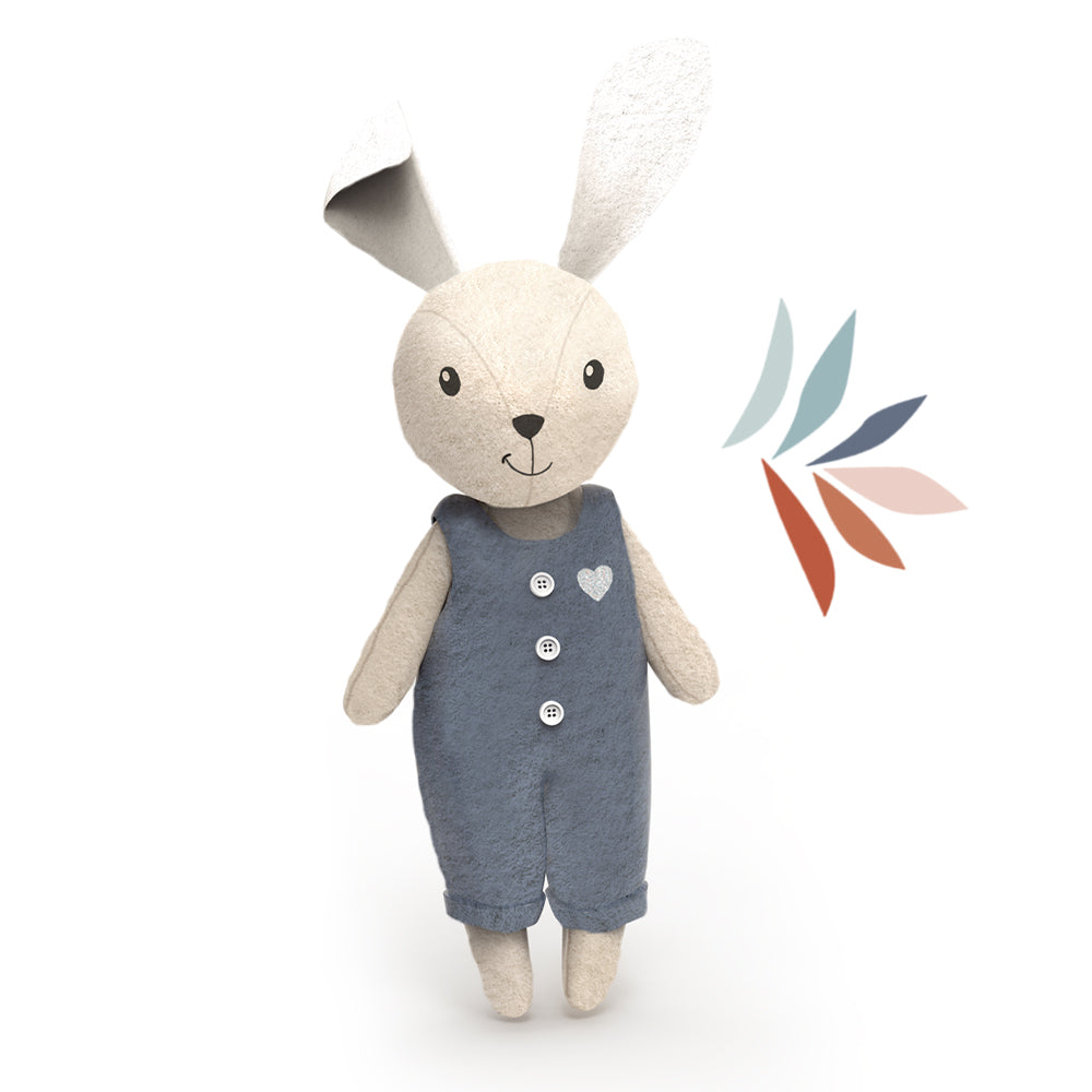 Rabbit plush doll wearing navy romper with button details and heart patch