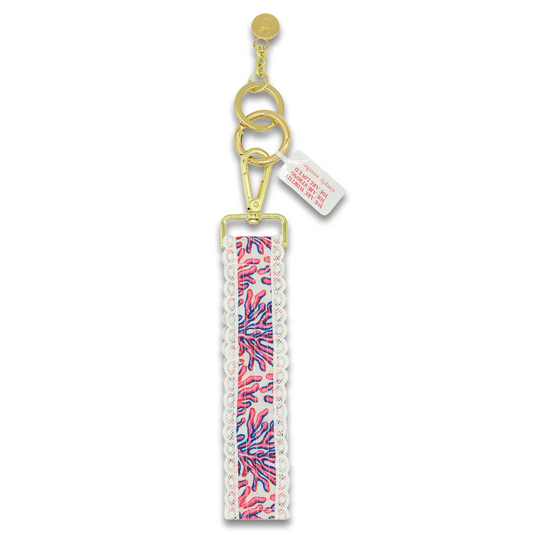 Coral lace keyfob with gold keyring and patterned lace strap