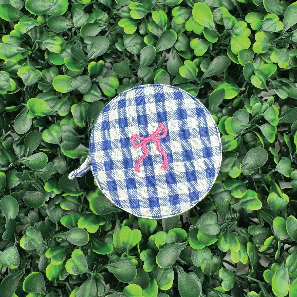 Navy gingham tape measure case with pink ribbon and stitched handle