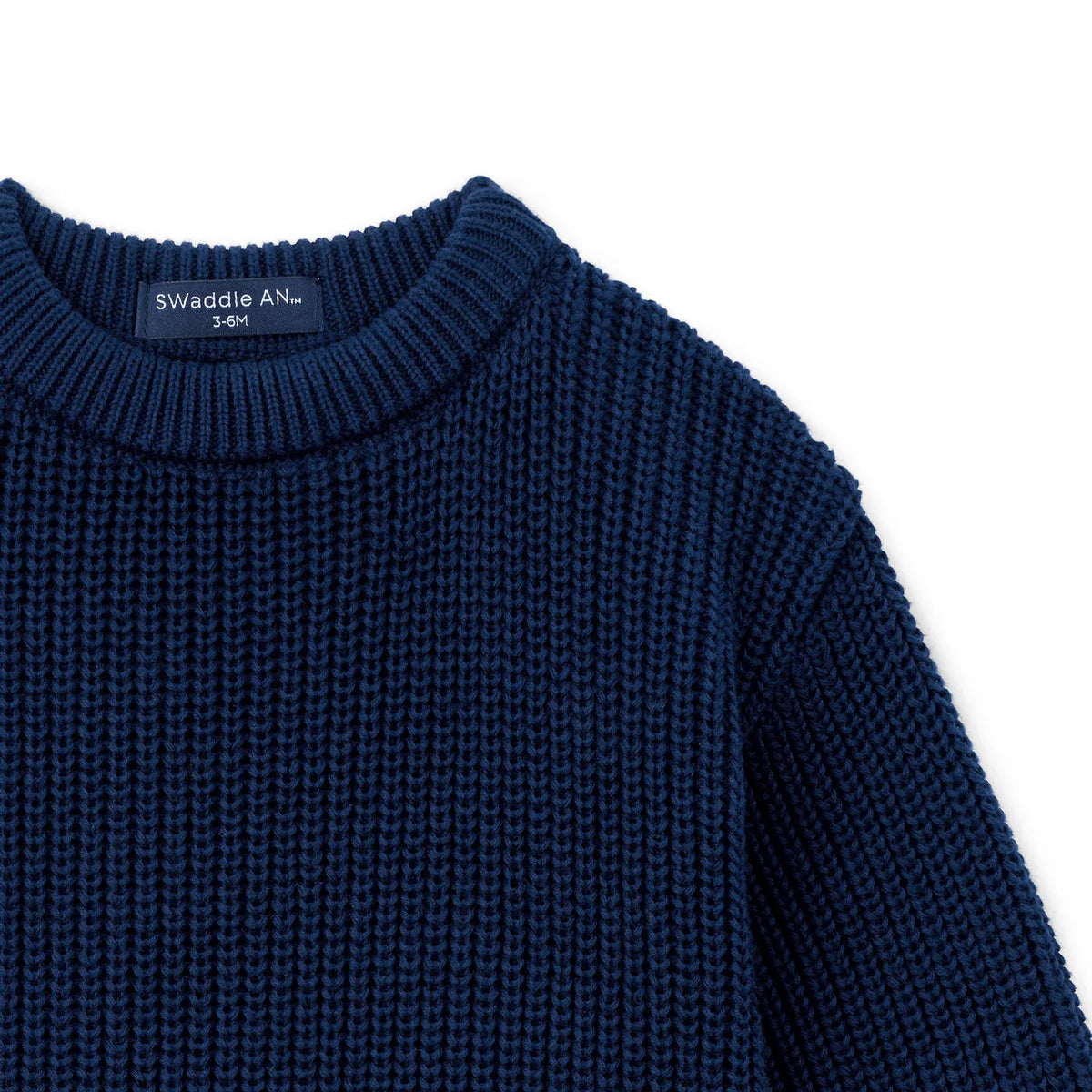 Navy chunky-knit baby romper shoulder and ribbed collar detail