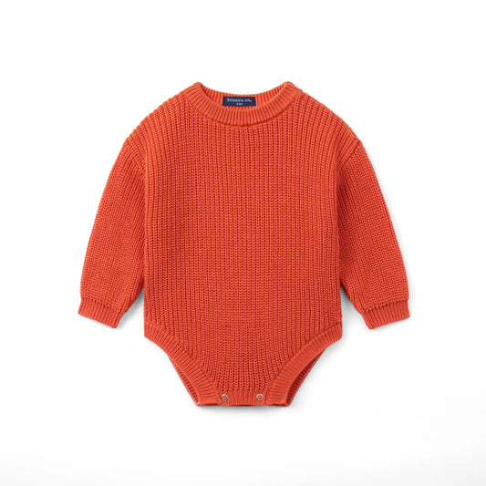 Orange rust chunky knit baby romper with long sleeves and snap button leg closure