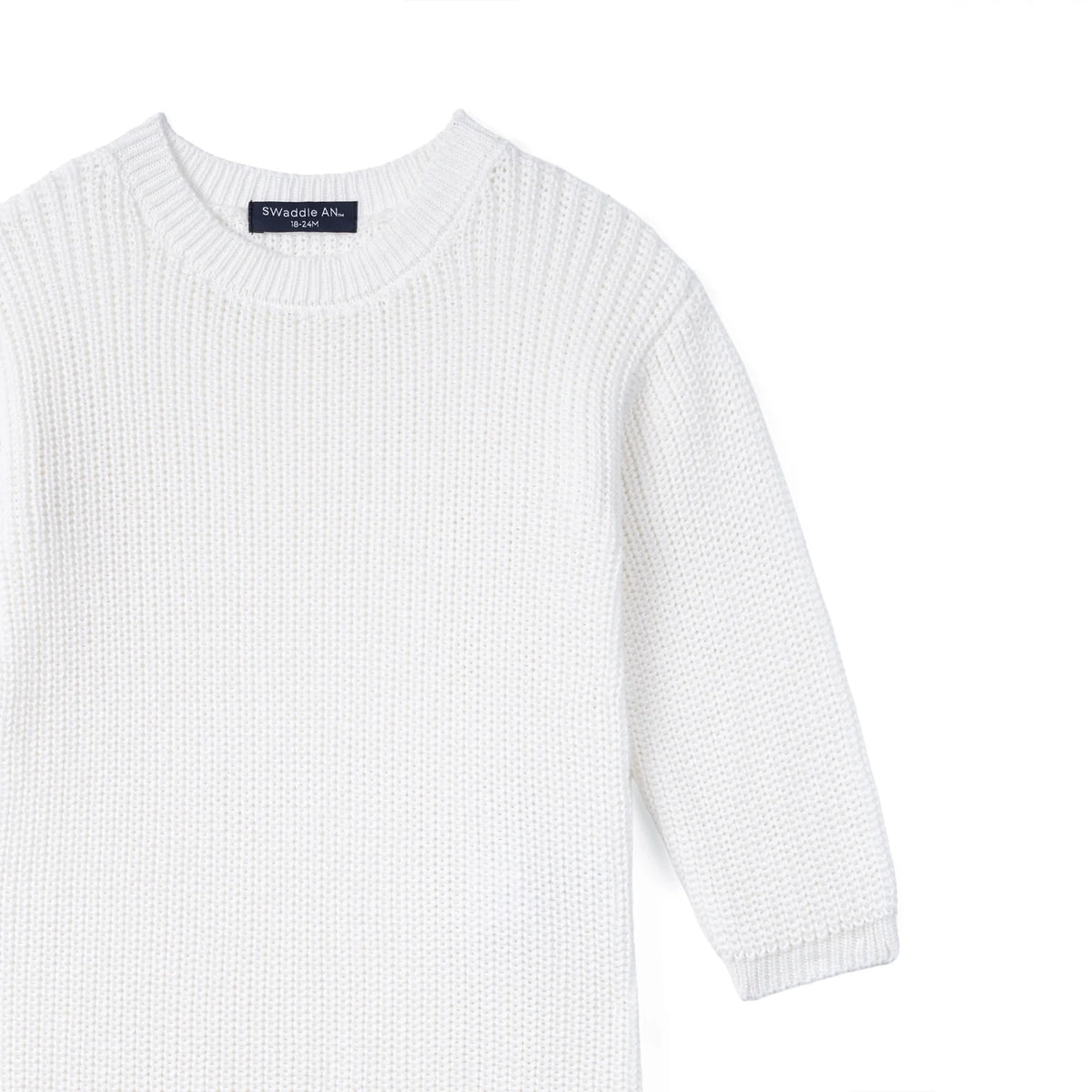 White knit baby romper with long sleeves and ribbed crew neck