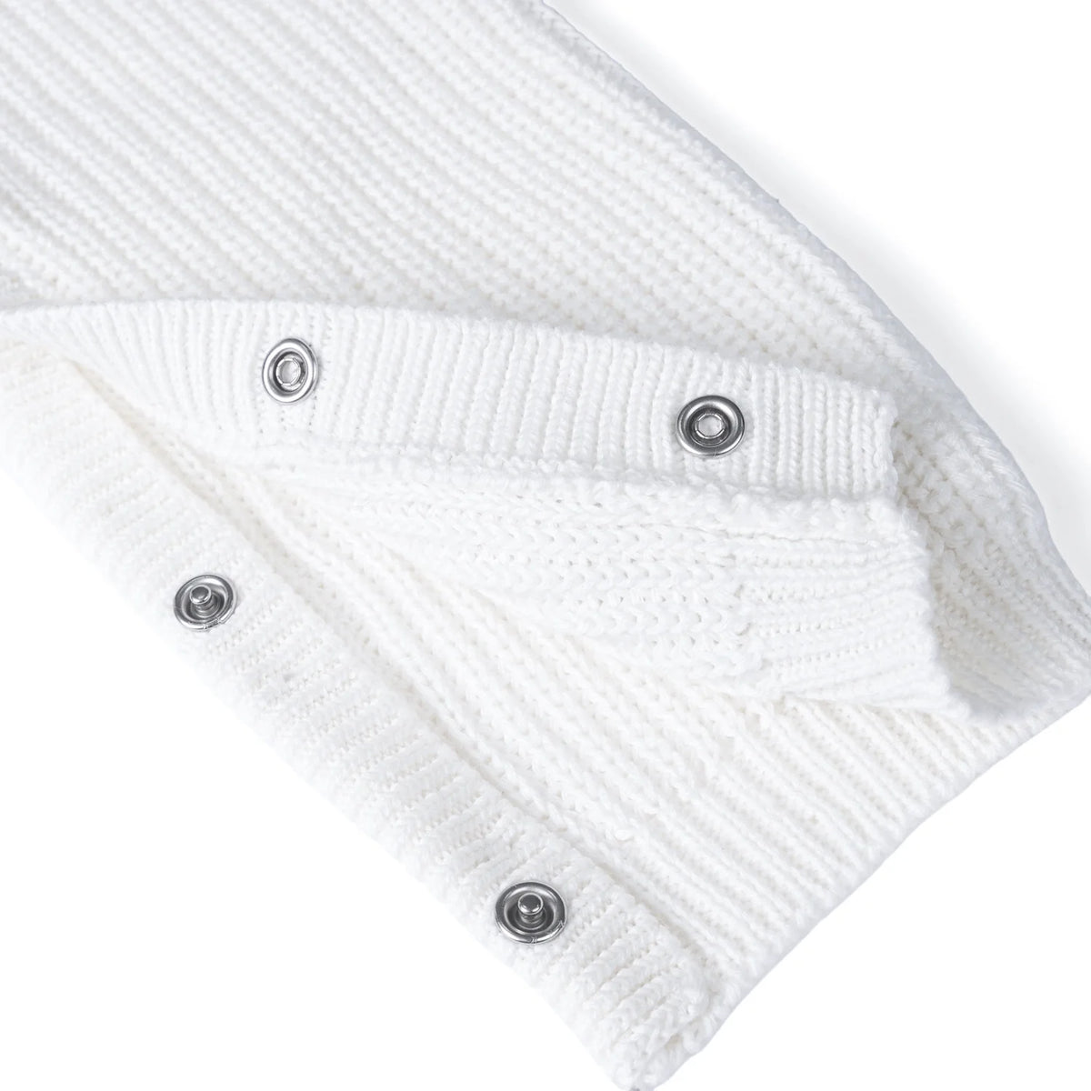 White knit romper leg snaps detail with round metal buttons