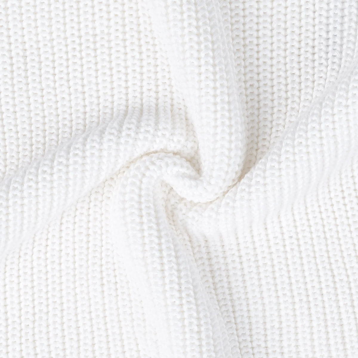 White textured knit fabric on baby romper
